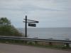 Park sign against Lake Superior