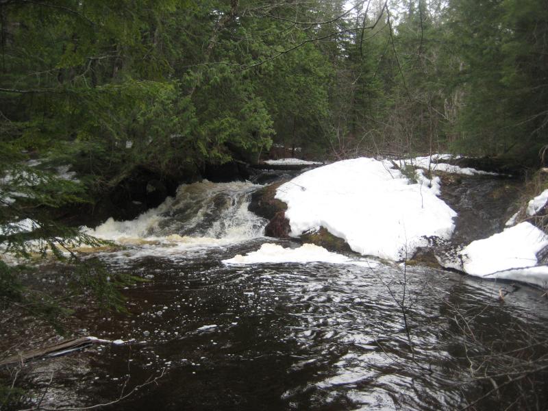 Snowy drop into a deep pool