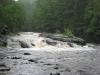 River dashing out of the canyon above