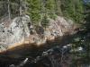 Rock walls stained by the tainted waters