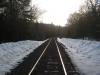 Snowy train tracks stretching away