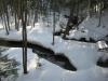Split creek in a snowy valley