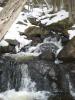 Tumbling cascade over grey rock