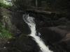 Dark little chute between dark rocks