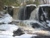 Multiple plunges of water off the sharp ledge