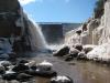 Looking up at towers of rock, cement, water, and ice