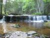 Overhanging ledge creating a small waterfall