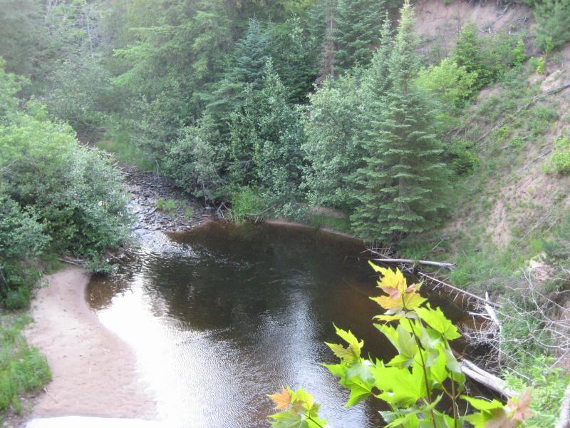 Looking down from the tall, sandy bank