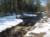 Peering upstream beyond the waterfall