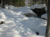 Mounds of white lying over the waterfall